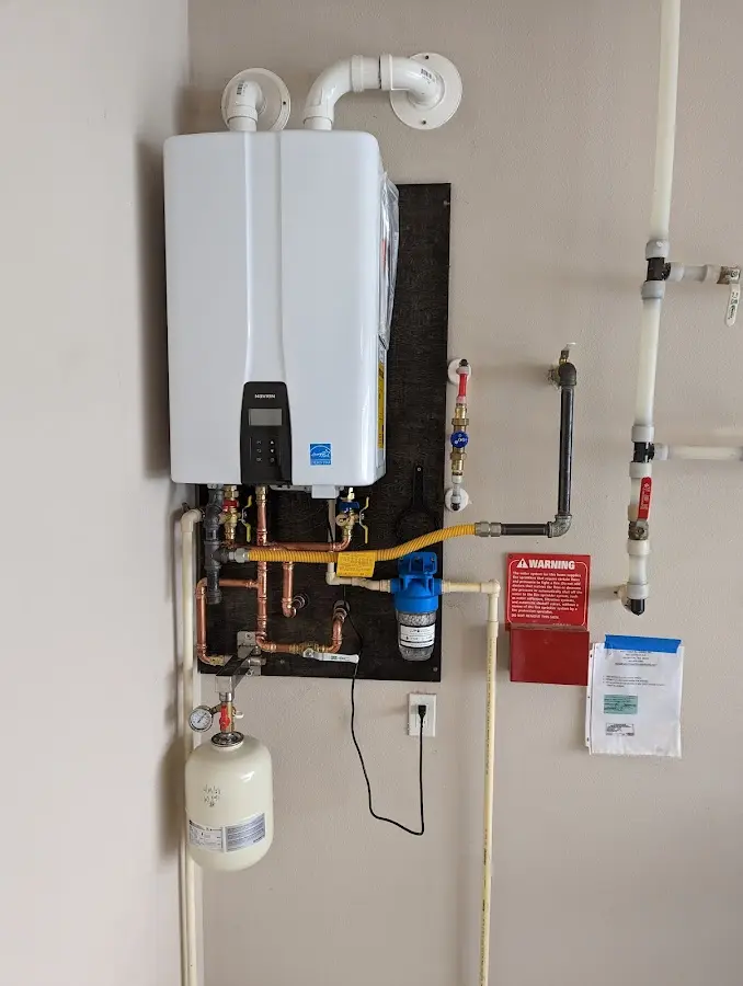 Professional plumber installing copper piping in a Darnestown home